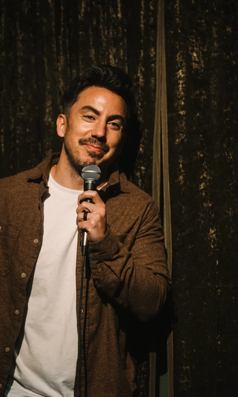 Evan Lopez performing stand-up in Austin